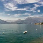 A beautiful terrace of a property in Italy overlooking a lake, illustrating the topic of refinancing property in Italy.