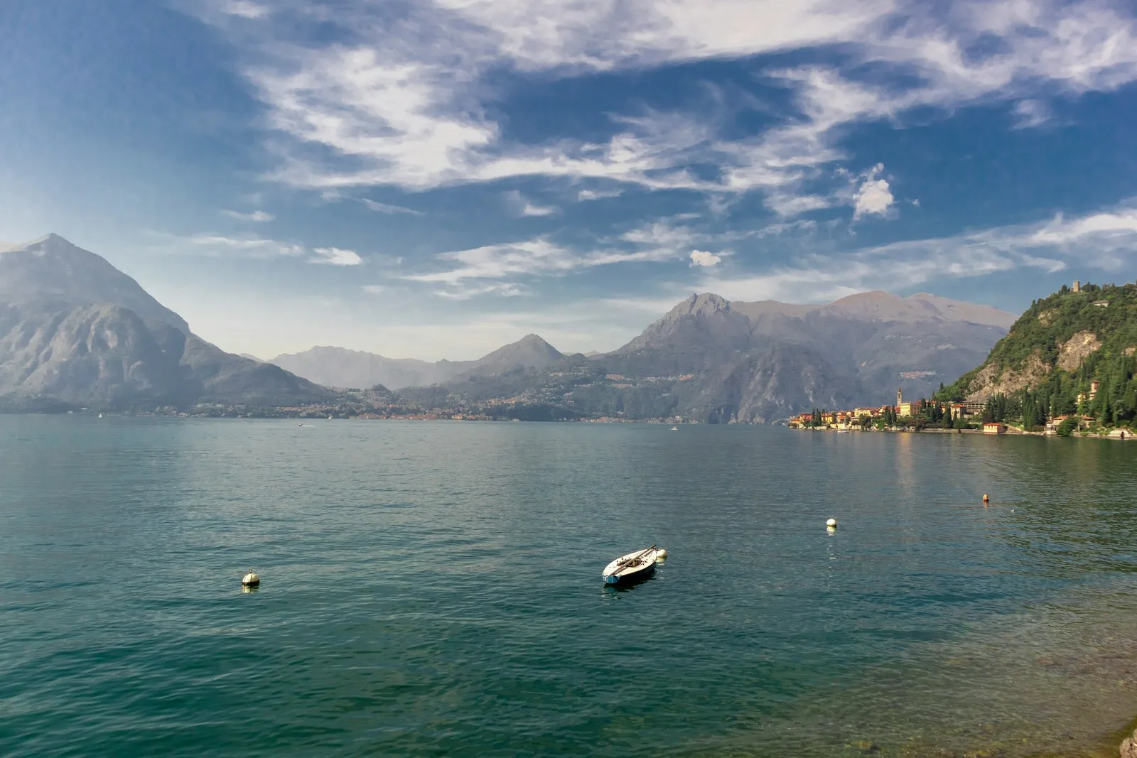 A beautiful terrace of a property in Italy overlooking a lake, illustrating the topic of refinancing property in Italy.