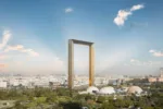 An investor reviewing documents for a UAE residency visa with a modern Dubai building in the background.