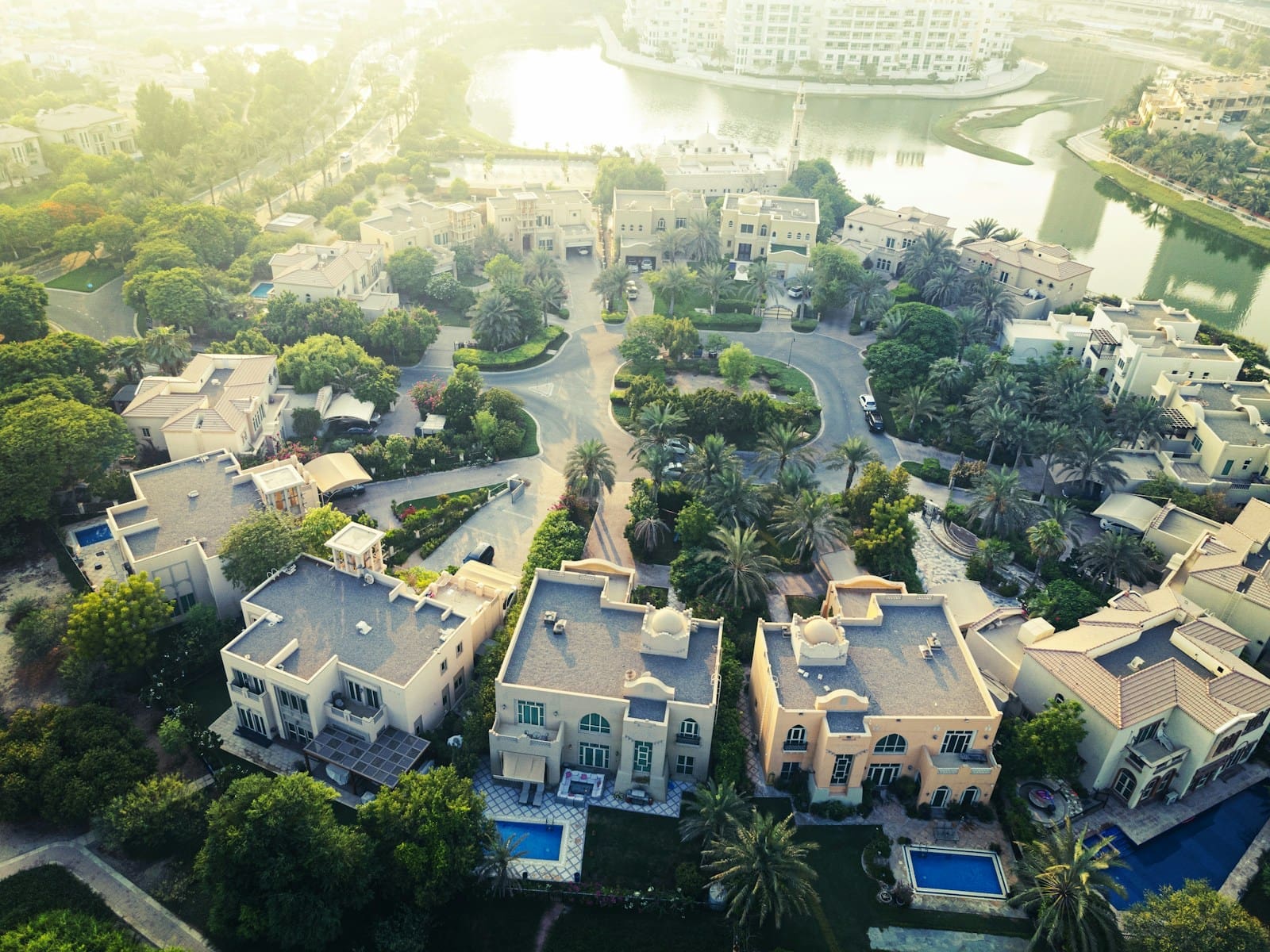 Modern luxury villas with swimming pools on Palm Jumeirah, Dubai, a symbol of the premium Dubai's property market.