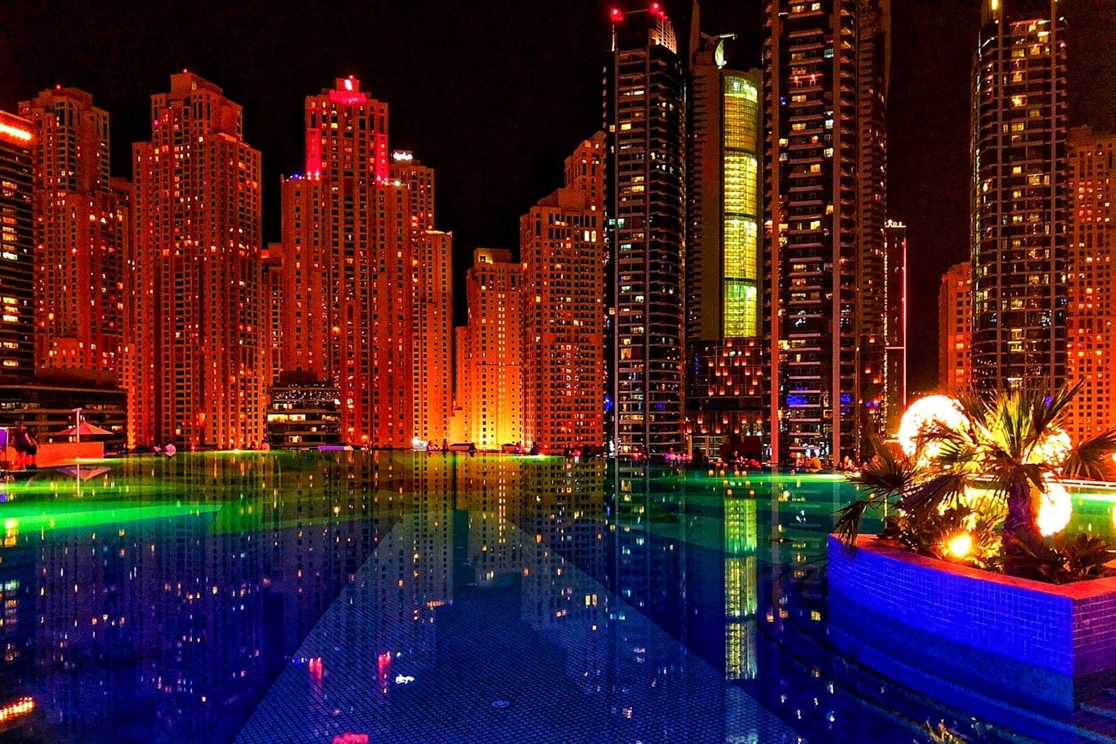 Night view of the Dubai skyline with illuminated skyscrapers, symbolizing the Dubai 2040 Master Plan.