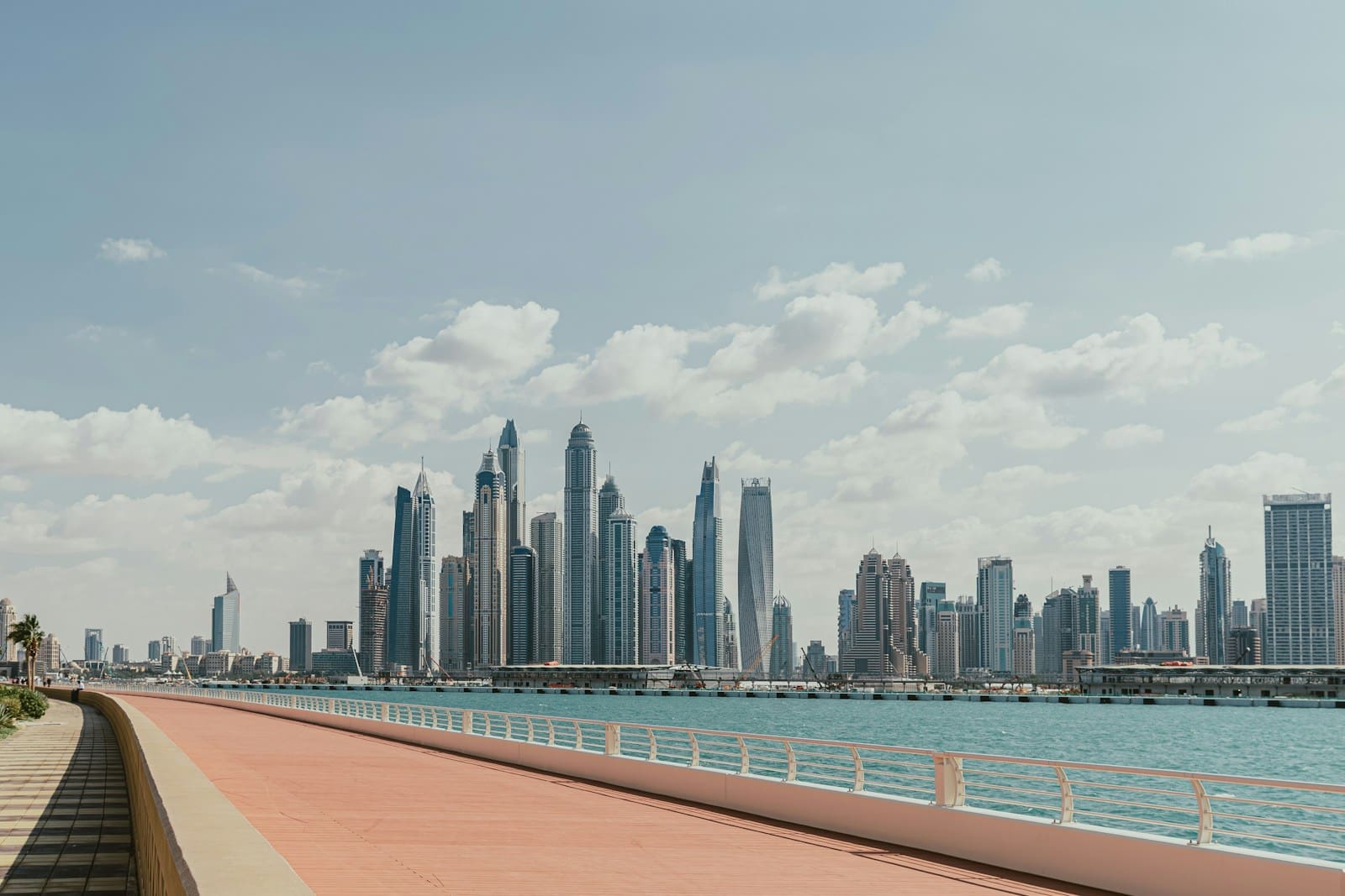 Panoramic view of Dubai skyline with modern skyscrapers at sunset